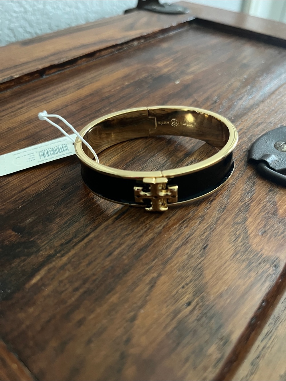 Tory Burch Black and Gold Logo Hinged Bangle